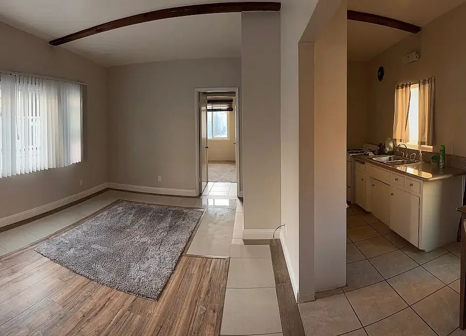 Living area of a residence at 454 Orange Avenue with hardwood flooring.