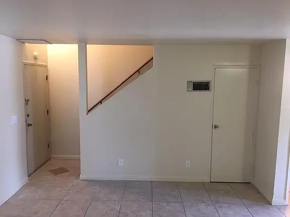 Entry and the staircase to the upper floor inside a townhome at 635 11th Street.